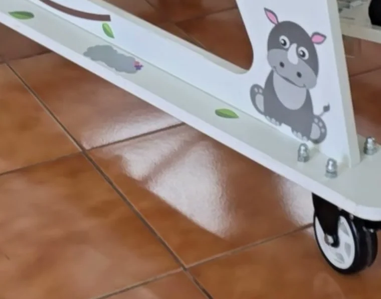 Close-up of the printed plywood frame and a castor